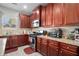 Kitchen boasts ample cabinet space and granite countertops at 7705 Sylvaner Ln, Atlanta, GA 30349