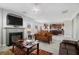 Living room with a fireplace and ample natural light at 7705 Sylvaner Ln, Atlanta, GA 30349