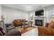 Living room with fireplace and a view into the kitchen at 7705 Sylvaner Ln, Atlanta, GA 30349