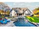 Stunning pool area with a fire pit and plenty of lounge chairs at 201 Edwards Brook Ct, Canton, GA 30115