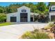 White barn with dark brown doors and Golden Willow Barn sign at 201 Edwards Brook Ct, Canton, GA 30115