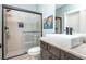 Bathroom with a walk-in shower and floating vanity at 201 Edwards Brook Ct, Canton, GA 30115