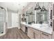 Elegant bathroom with dual vanities, a large walk-in shower, and modern finishes at 201 Edwards Brook Ct, Canton, GA 30115