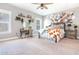 Main bedroom with a metal bed frame and a large collage wall at 201 Edwards Brook Ct, Canton, GA 30115