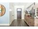 Bright entryway with hardwood floors, storage, and rustic console table at 201 Edwards Brook Ct, Canton, GA 30115