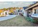 Farmhouse exterior, featuring a large driveway and landscaping at 201 Edwards Brook Ct, Canton, GA 30115