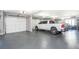 Large garage with epoxy flooring and ample space for two vehicles at 201 Edwards Brook Ct, Canton, GA 30115