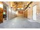 Spacious garage with exposed beams, brick walls, and American flag at 201 Edwards Brook Ct, Canton, GA 30115