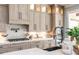 Modern kitchen with white quartz countertops, stainless steel appliances, and light wood cabinets at 201 Edwards Brook Ct, Canton, GA 30115