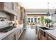 Modern kitchen with white quartz countertops, stainless steel appliances, and light wood cabinets at 201 Edwards Brook Ct, Canton, GA 30115