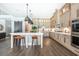 Modern kitchen with large island and stainless steel appliances at 201 Edwards Brook Ct, Canton, GA 30115