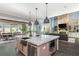 Open kitchen with oversized island, stainless steel appliances & views into Gathering room at 201 Edwards Brook Ct, Canton, GA 30115