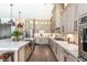 Gourmet kitchen with large island and marble countertops at 201 Edwards Brook Ct, Canton, GA 30115