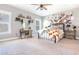 Bright main bedroom with a metal bed frame and collage wall at 201 Edwards Brook Ct, Canton, GA 30115