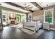 Spacious main bedroom with a large bed, exposed beams, and fireplace at 201 Edwards Brook Ct, Canton, GA 30115