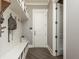 Functional mudroom with built-in bench, hooks, and shelving at 201 Edwards Brook Ct, Canton, GA 30115