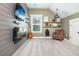 Home office with floating shelves, electric fireplace, and comfy chair at 201 Edwards Brook Ct, Canton, GA 30115