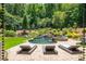 Resort-style pool and spa with waterfall feature at 201 Edwards Brook Ct, Canton, GA 30115