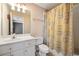 Small bathroom with shower/tub combo and patterned curtain at 6820 Milbury Ct, Alpharetta, GA 30005