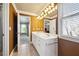 Double vanity bathroom with a view into a bedroom at 6820 Milbury Ct, Alpharetta, GA 30005