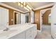 Double vanity bathroom with access to bedroom at 6820 Milbury Ct, Alpharetta, GA 30005