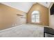 Bright bedroom with vaulted ceiling, carpet, and large window at 6820 Milbury Ct, Alpharetta, GA 30005