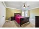 Spacious bedroom with a dark wood bed frame and ceiling fan at 6820 Milbury Ct, Alpharetta, GA 30005