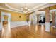 Spacious dining room with hardwood floors and a view of the kitchen at 6820 Milbury Ct, Alpharetta, GA 30005