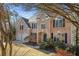 Two-story brick home with a large front yard and mature trees at 6820 Milbury Ct, Alpharetta, GA 30005