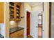 Kitchen with built-in shelving and access to other rooms at 6820 Milbury Ct, Alpharetta, GA 30005