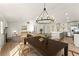 Spacious dining area with chandelier and hardwood floors at 124 Woodcrest Way, Mcdonough, GA 30253