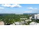 Aerial perspective showcasing city skyline, botanical garden, and Piedmont Park at 34 Peachtree Ne Cir, Atlanta, GA 30309