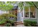 Private backyard oasis with flagstone patio, lush landscaping, and mature trees at 34 Peachtree Ne Cir, Atlanta, GA 30309