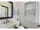 Simple bathroom with white vanity and updated fixtures at 34 Peachtree Ne Cir, Atlanta, GA 30309