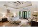 Main bedroom with high ceilings, hardwood floors, and access to a balcony at 34 Peachtree Ne Cir, Atlanta, GA 30309