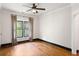 Spacious bedroom with hardwood floors and large window at 34 Peachtree Ne Cir, Atlanta, GA 30309