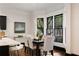 Bright dining area with hardwood floors and a large window at 34 Peachtree Ne Cir, Atlanta, GA 30309