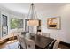 Bright dining room with hardwood floors and stained glass window at 34 Peachtree Ne Cir, Atlanta, GA 30309