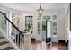 Bright entryway with built in shelving and hardwood floors at 34 Peachtree Ne Cir, Atlanta, GA 30309