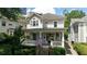 Two-story house with wraparound porch, stone steps, and American flag at 34 Peachtree Ne Cir, Atlanta, GA 30309