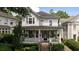 Two-story house with wraparound porch, stone steps, and American flag at 34 Peachtree Ne Cir, Atlanta, GA 30309
