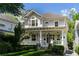 Two story home with wrap around porch and manicured landscaping at 34 Peachtree Ne Cir, Atlanta, GA 30309