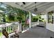 Spacious front porch with swing and hanging plants at 34 Peachtree Ne Cir, Atlanta, GA 30309