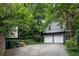Two-car garage with driveway and additional storage space at 34 Peachtree Ne Cir, Atlanta, GA 30309