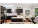 Eat-in kitchen features dark cabinetry, quartz countertops, and stainless steel appliances at 34 Peachtree Ne Cir, Atlanta, GA 30309