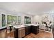 Modern kitchen with island, stainless steel appliances, and hardwood floors at 34 Peachtree Ne Cir, Atlanta, GA 30309