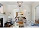Living room with open view to dining room and hardwood floors at 34 Peachtree Ne Cir, Atlanta, GA 30309
