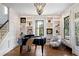 Living room with built-in shelving and grand piano at 34 Peachtree Ne Cir, Atlanta, GA 30309