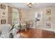 Living room with hardwood floors, and adjacent kitchenette at 34 Peachtree Ne Cir, Atlanta, GA 30309