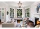 Bright living room with fireplace, hardwood floors, and large windows at 34 Peachtree Ne Cir, Atlanta, GA 30309